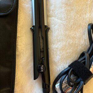 Travel size hair straightener with carrying case.